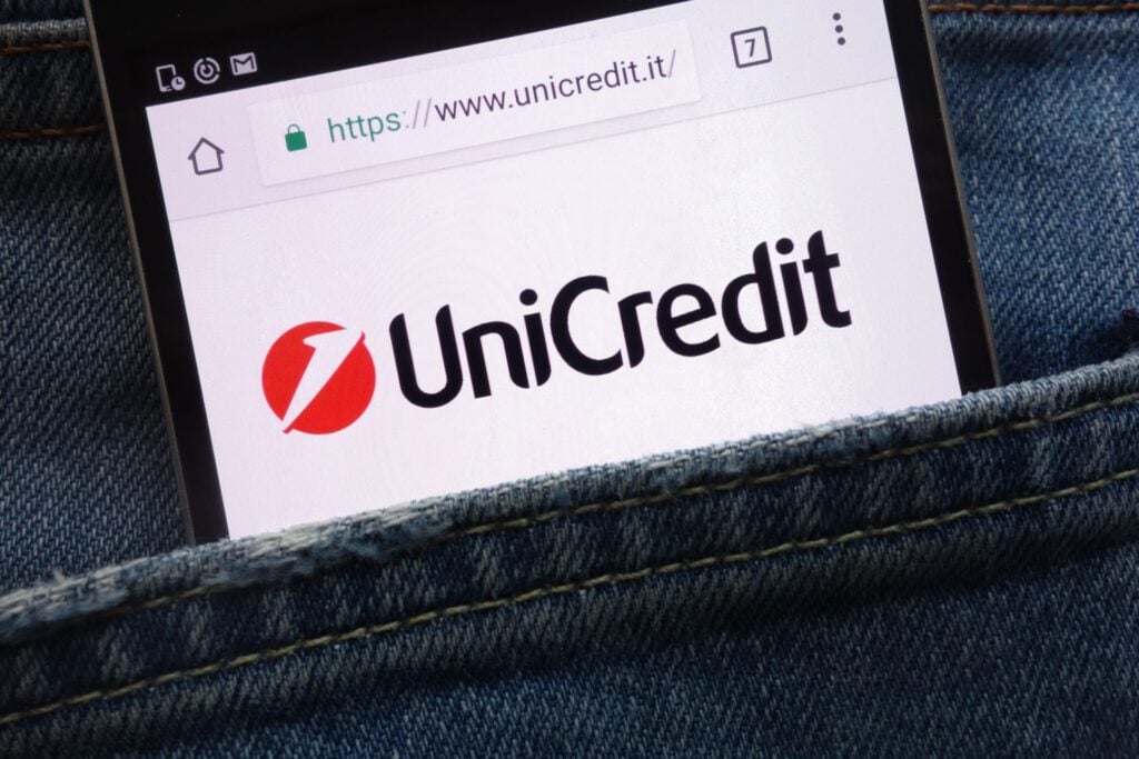 KONSKIE, POLAND - MAY 19, 2018: UniCredit website displayed on smartphone hidden in jeans pocket