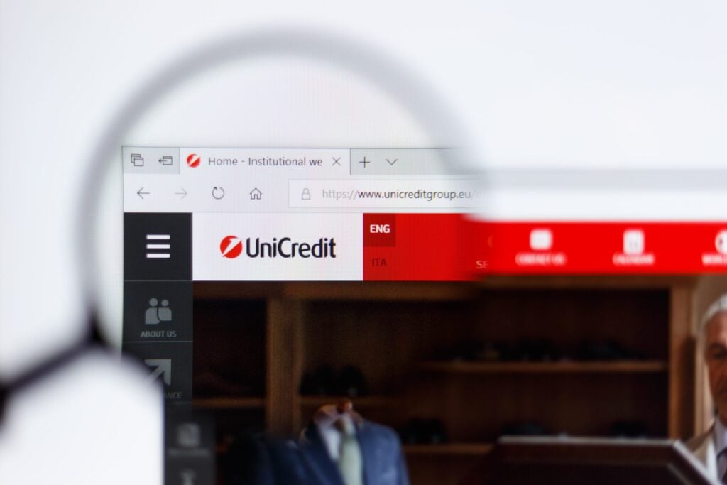 KONSKIE, POLAND - MAY 19, 2018: UniCredit website displayed on smartphone hidden in jeans pocket